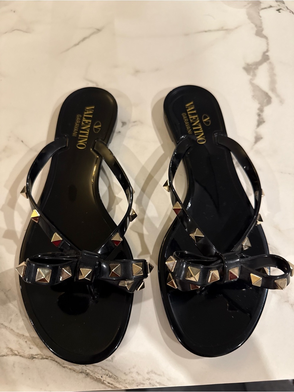 Valentino Garavani Black Jelly Rockstud Bow Thong Sandals